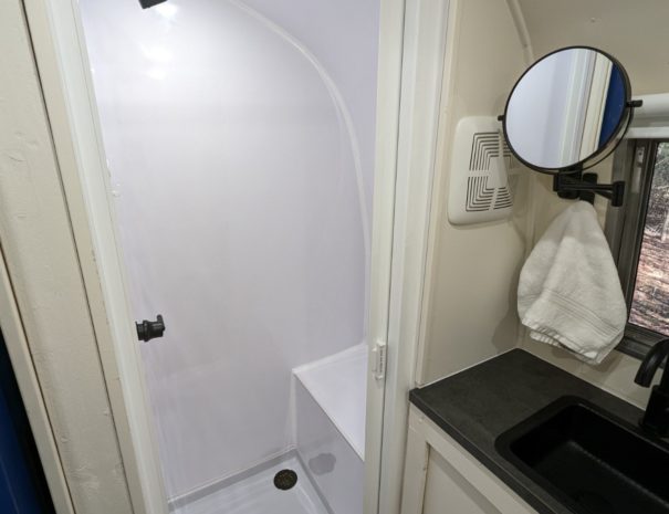 Experience comfort and convenience with our shower featuring a built-in bench for added relaxation