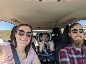 Road tripping and glamping - Nick driving, Olivia is the passenger, and daughter is in a car seat