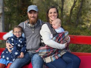 Nick and Olivia with their two children during their travels