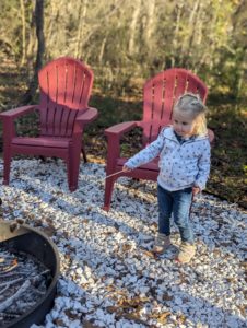 Emmelyn's daughter testing out the new disposable marshmallow sticks at our glamping retreat