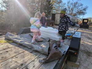 The Owners' Kids playing on a flatbed trailer at Riveted Retreat