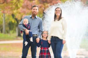 Nick and Olivia's family picture with their preschool aged daughter and baby boy